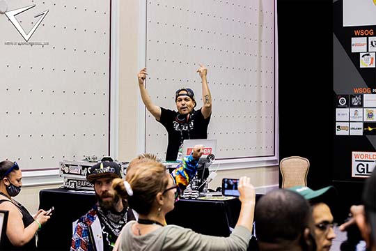 2021 - DJ Sergion on Stage with Sponsors in Background