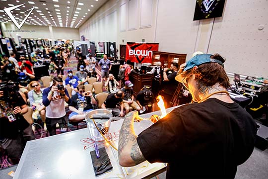 2021 - Niko on Stage with Blown Glass Goods Bar Sponsor